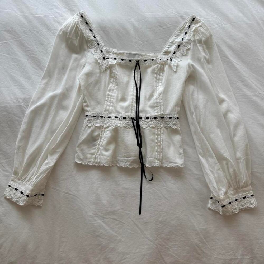 Reformation white blouse with black lace trim